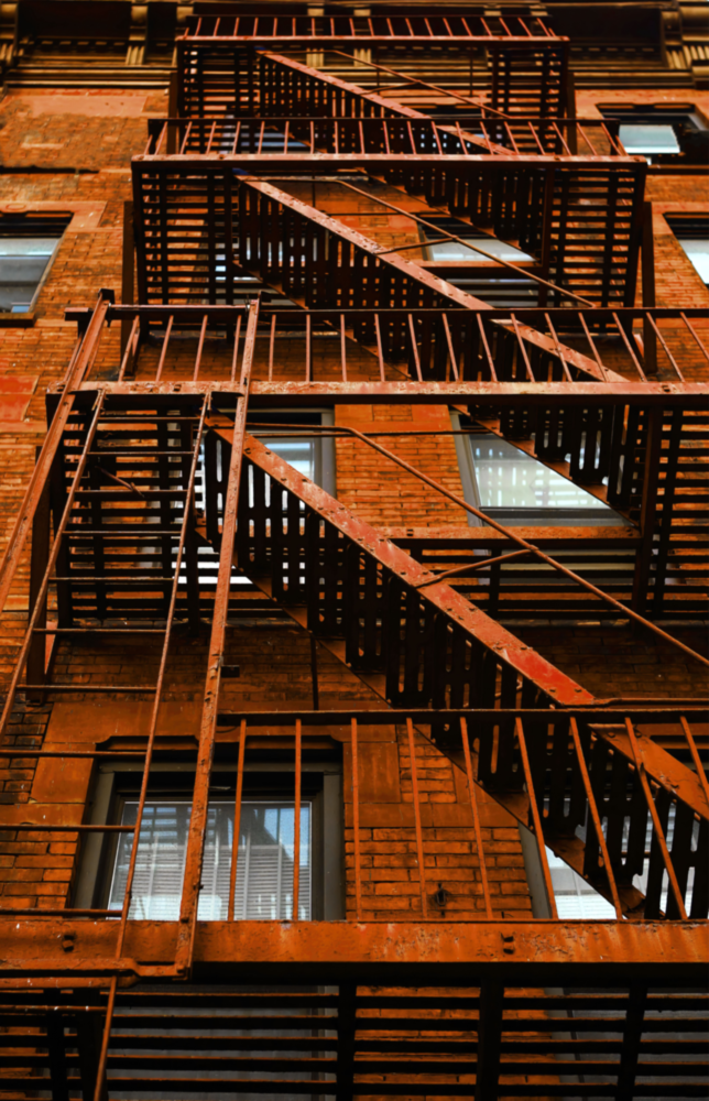 Orangefarbene Treppe Glasbild