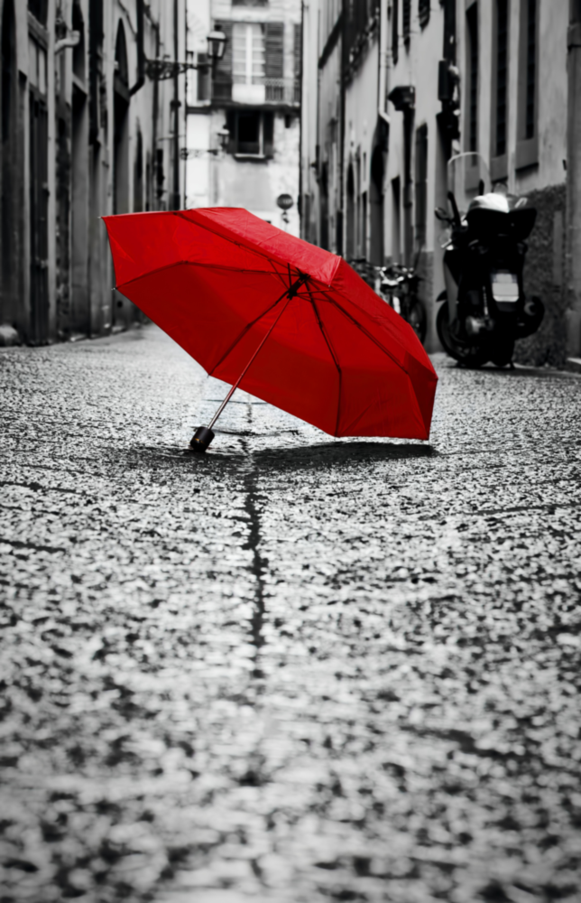 Roter Regenschirm Glasbild