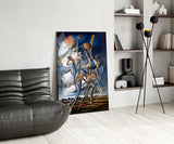 Stilt Figures Under Storm Sky Surreal Glass Wall Art