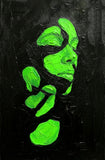 Green abstract face on a black textured background