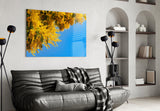 Golden Blossoms Against Blue Sky Glass Wall Art