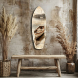 Beiges Kanu und fernes Segelboot Glasbild - 90x30 cm
