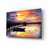 Rowboat by Pier Under Fiery Clouds Glass Wall Art - 72x46 cm