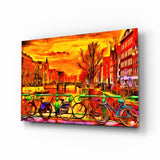 Quadro in vetro Bicicletta e città - 72x46 cm