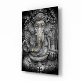 Steinerne Ganesha-Statue mit Goldakzenten Glasbild - 72x46 cm