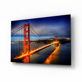 Golden Gate Bridge im Lichterglanz zur blauen Stunde Glasbild - 72x46 cm