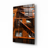 Orangefarbene Treppe Glasbild